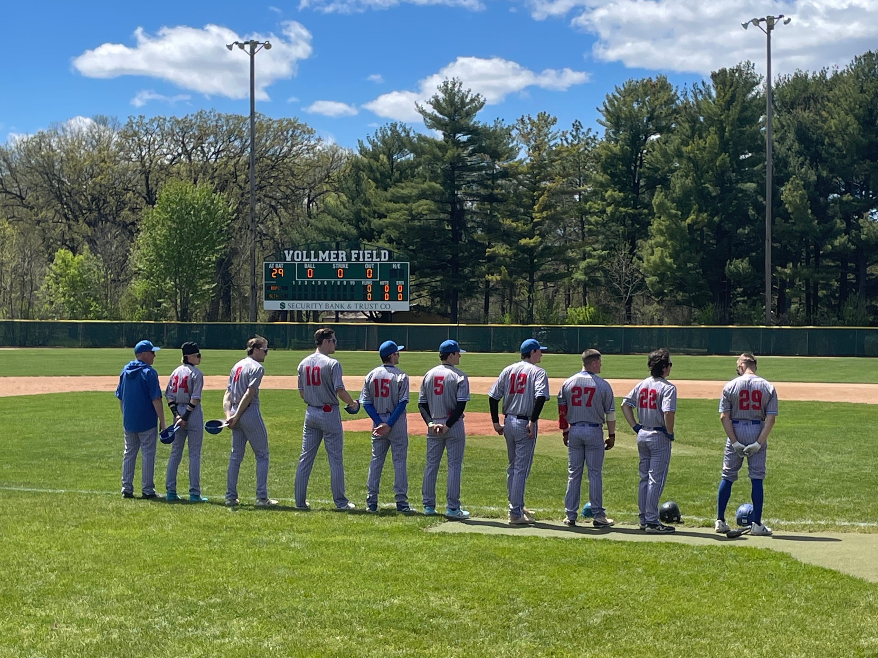 Hamel Hawks players line up for National Anthem at Vollmer Field in Glencoe, MN