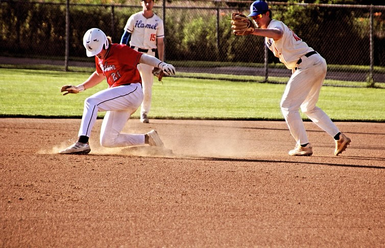 Hudson River Rats player slides into second base as Alex Wattermann applies tag